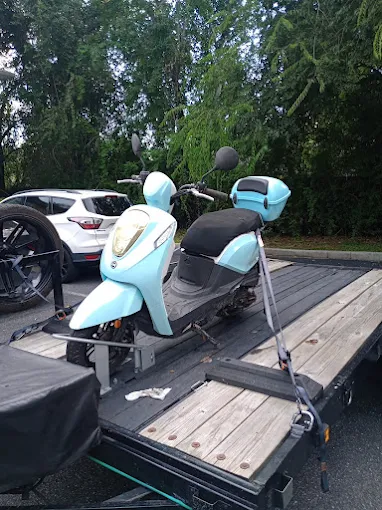 Scooter secured on a towing trailer in Gainesville, FL